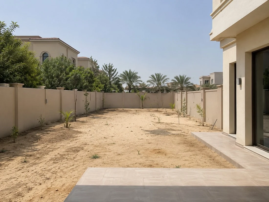 Before image of a bare Dubai villa back garden